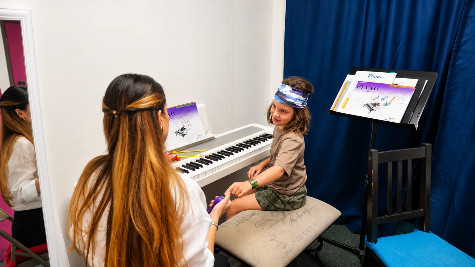 Young piano student in a lesson